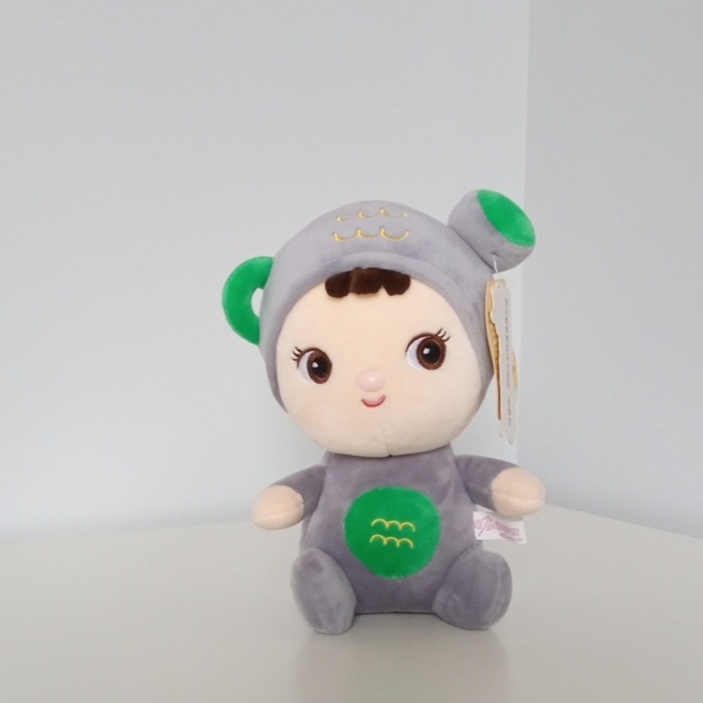Gray and Green Plush Toy